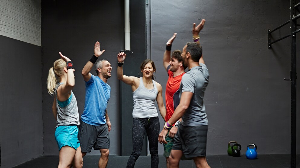 Group of gymters celebrating workout after class