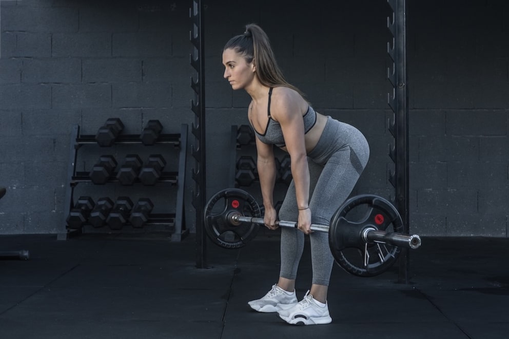 A woman doing deadlifts