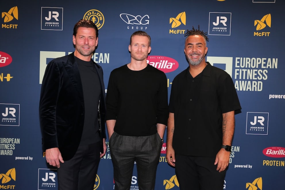Former soccer players Roman Weidenfeller, André Schürrle, and Patrick Owomoyela