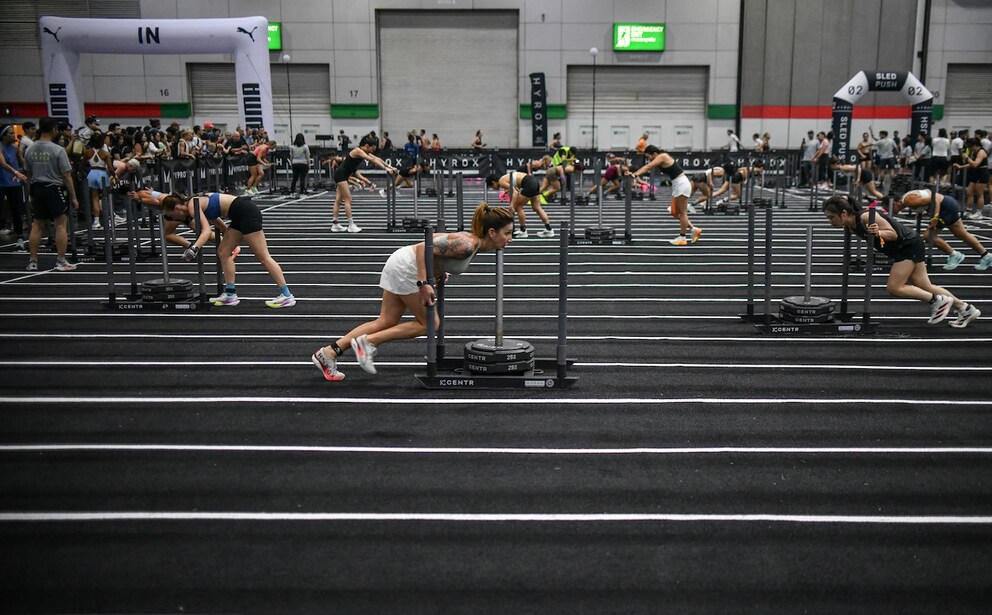 woman pushing sled