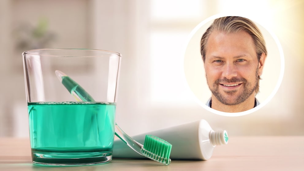 Ein Glas Mundspülung und Zahnbürste