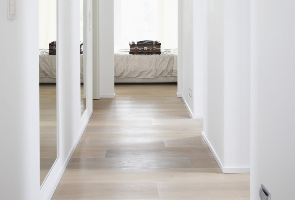 Hallway with light parquet flooring