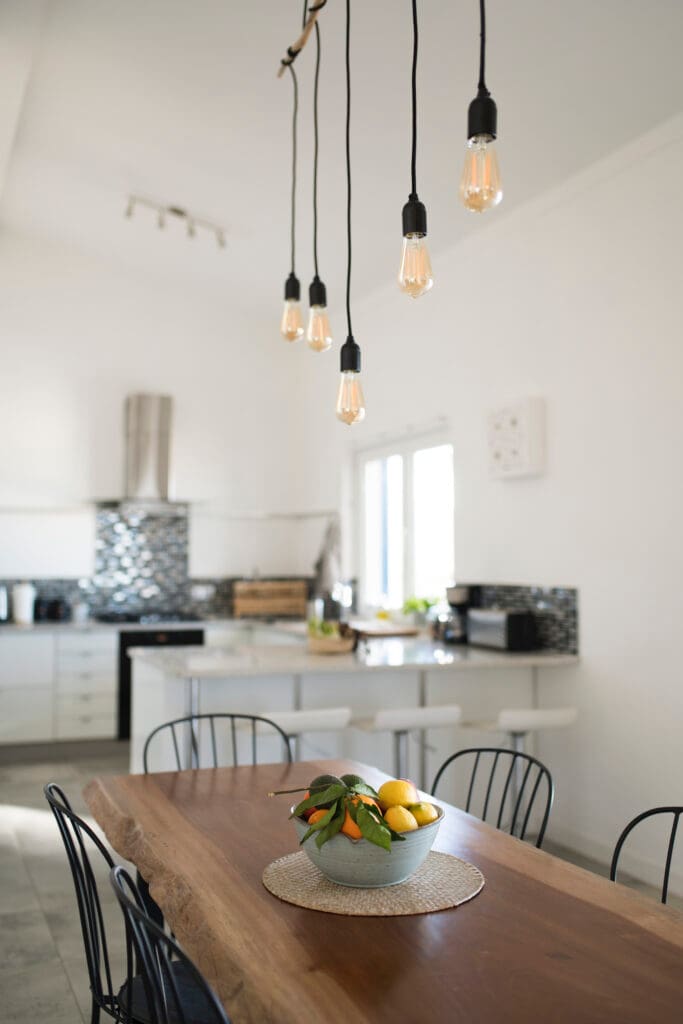 Make small dining rooms appear larger with delicate, functional furniture