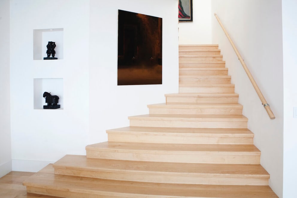 A staircase can be decorated with pictures