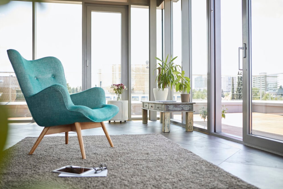 A turquoise armchair in an apartment