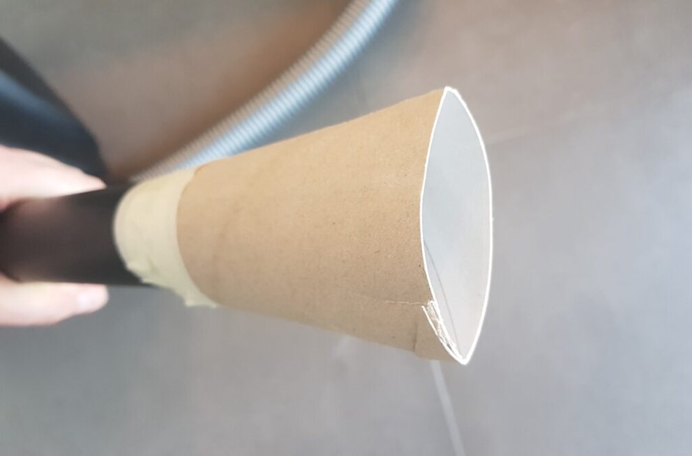 Vacuum cleaner with toilet paper roll