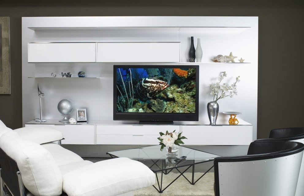 White living wall modules on a white back wall surrounded by a modern setting