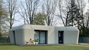 Haus 3D-Drucker: Ein Haus aus dem 3-D-Drucker mit grauem Beton