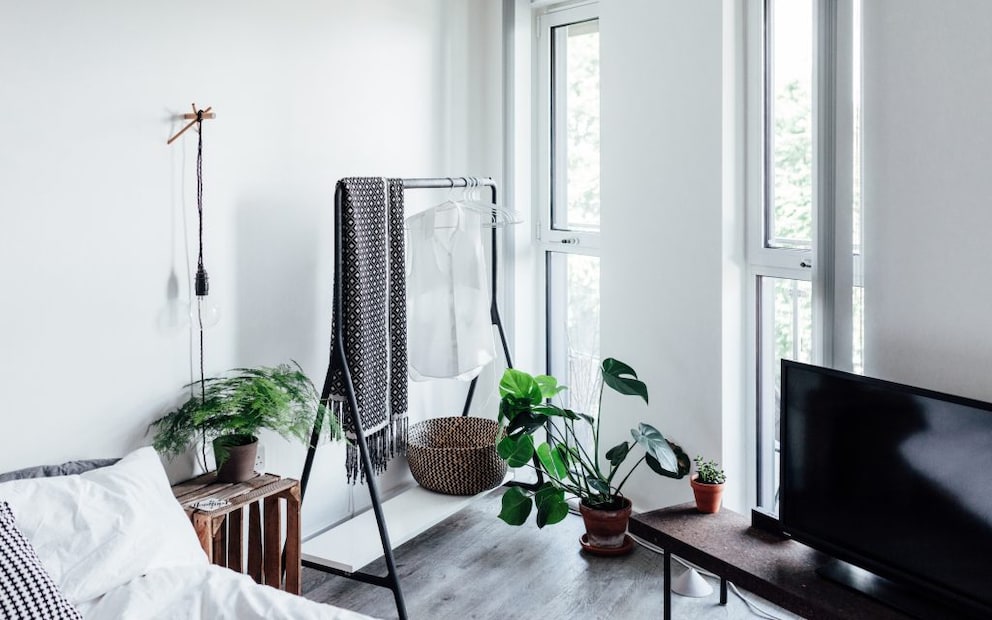 Clothes rack in a minimalist bedroom