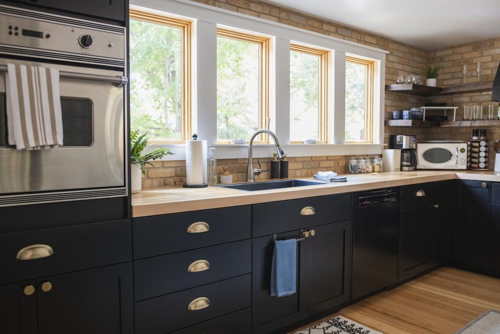 Modern kitchen in black with shell handles and a few accessories