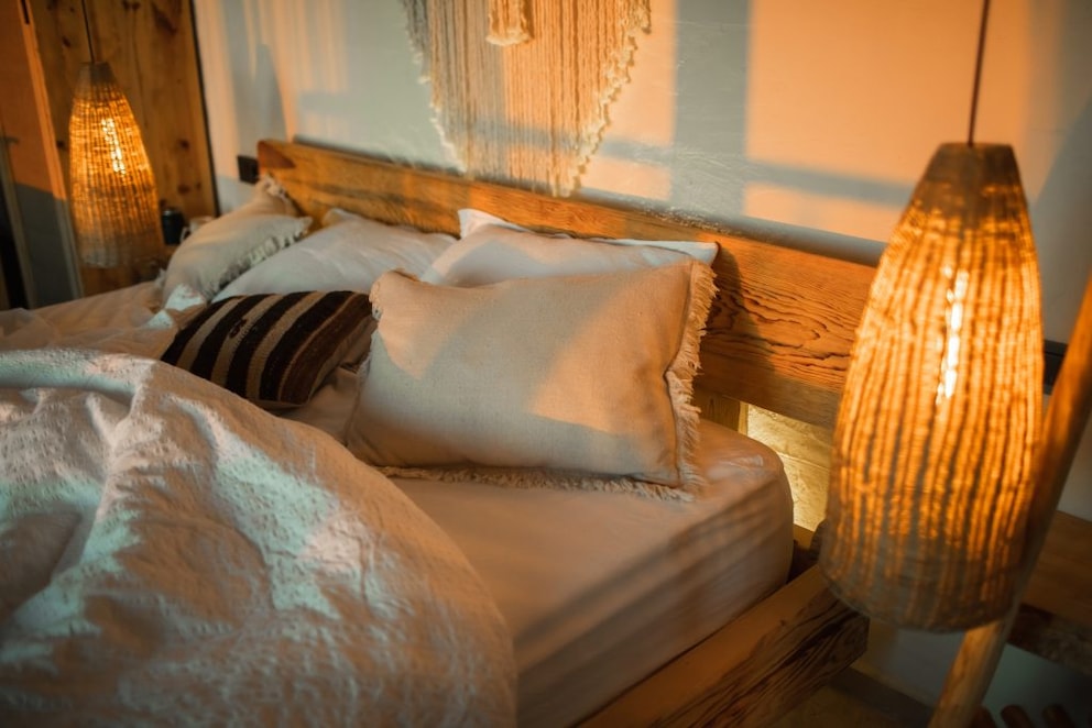 A wooden bed is best suited for a sustainably furnished bedroom