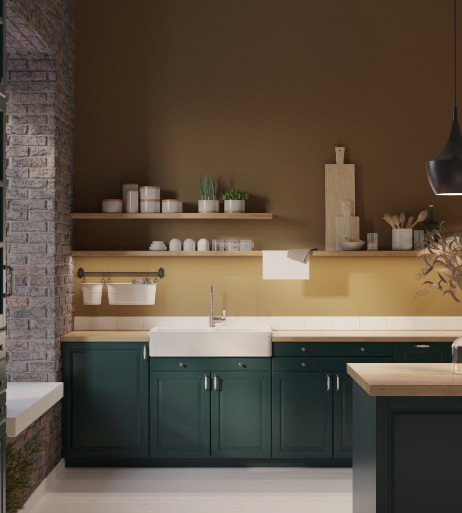 Modern country kitchen in dark moss green combined with modern ocher