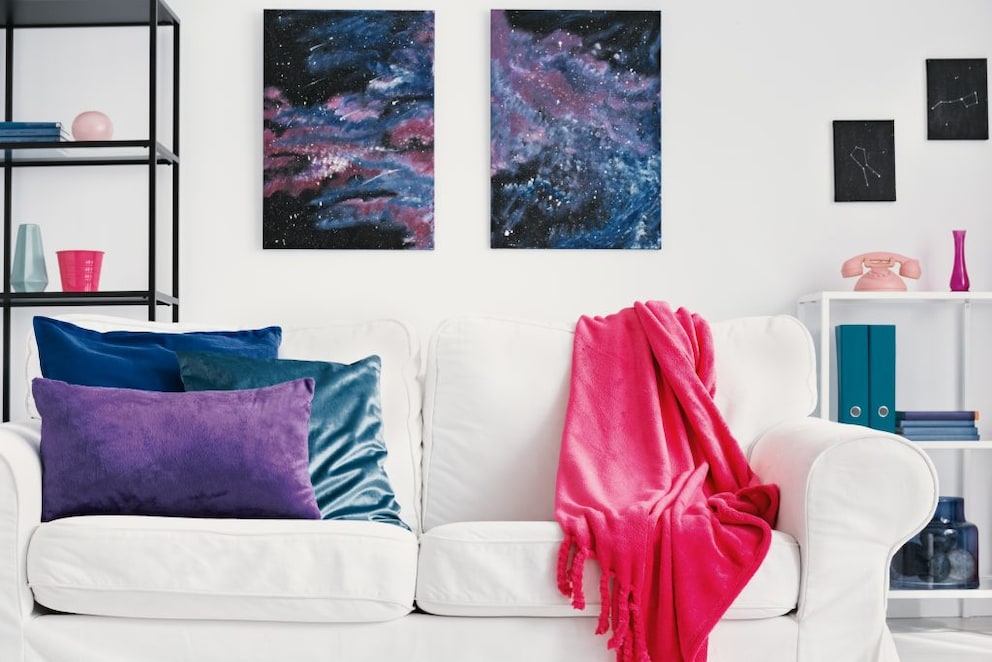 Two posters on the wall with galaxies