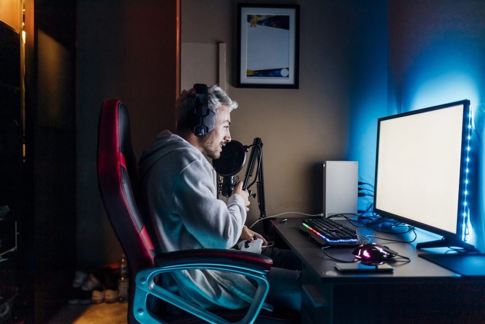 Young man in ergonomically designed gaming chair