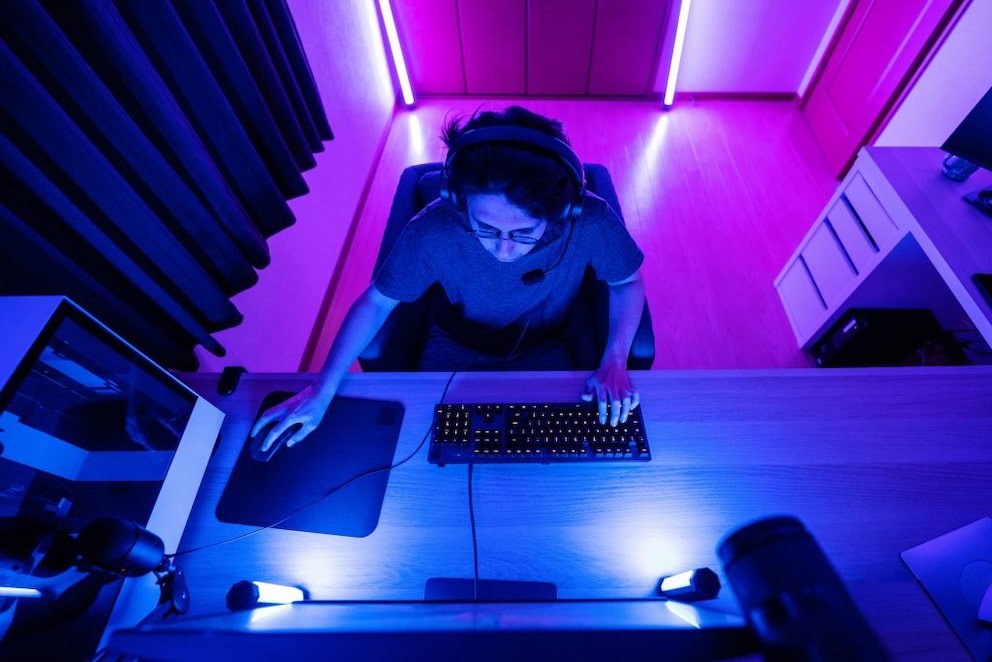 Young person in gaming room with lots of indirect light