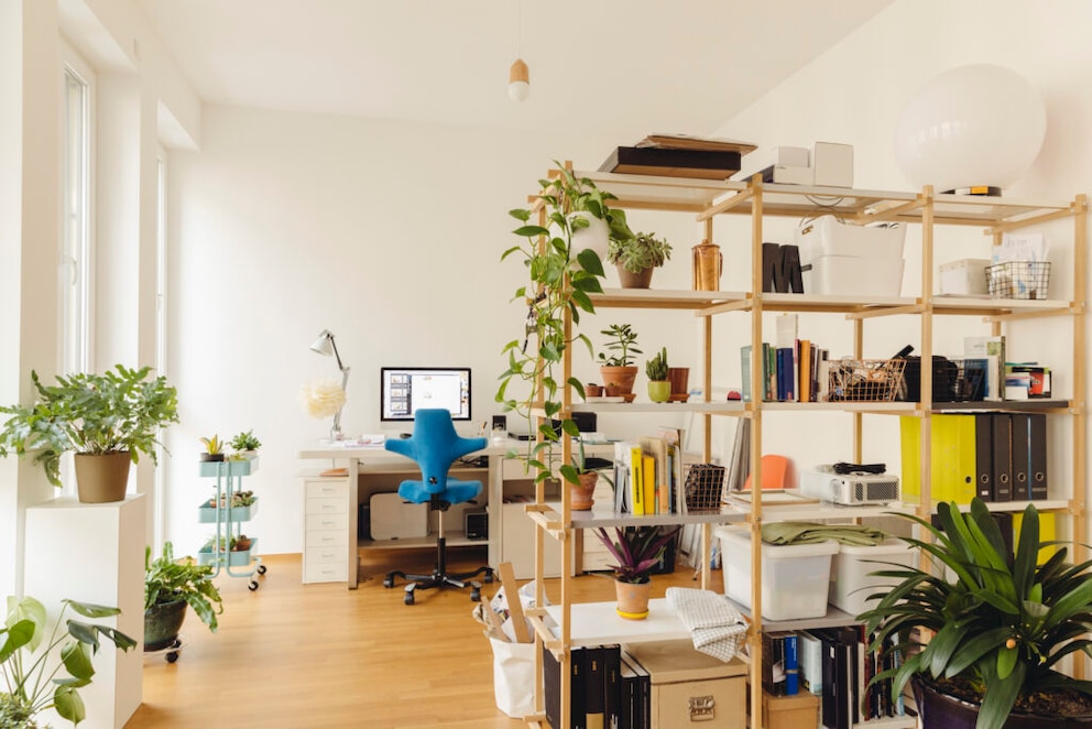 A room divider provides more storage and privacy in the home office