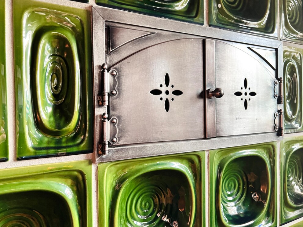 Stove with green ceramic tiles