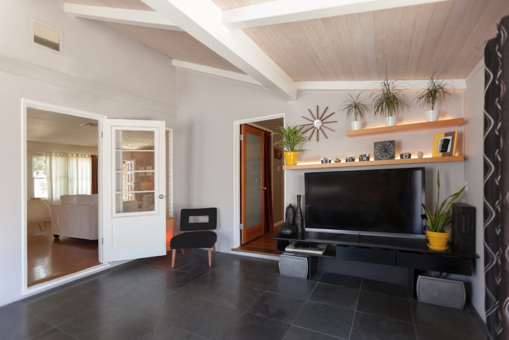 Wall shelves in the living room with indirect lighting
