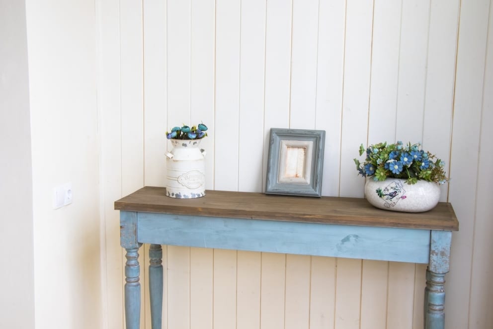 Sideboard in the hallway painted in light blue chalk paint