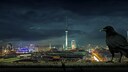 Kr&auml;he &uuml;berblickt die leuchtende Stadt Berlin