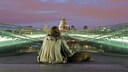 Ein obdachloser Mann und sein Hund bei Nacht auf der Millennium Bridge mit der St. Paul's Cathedral im Hintergrund.