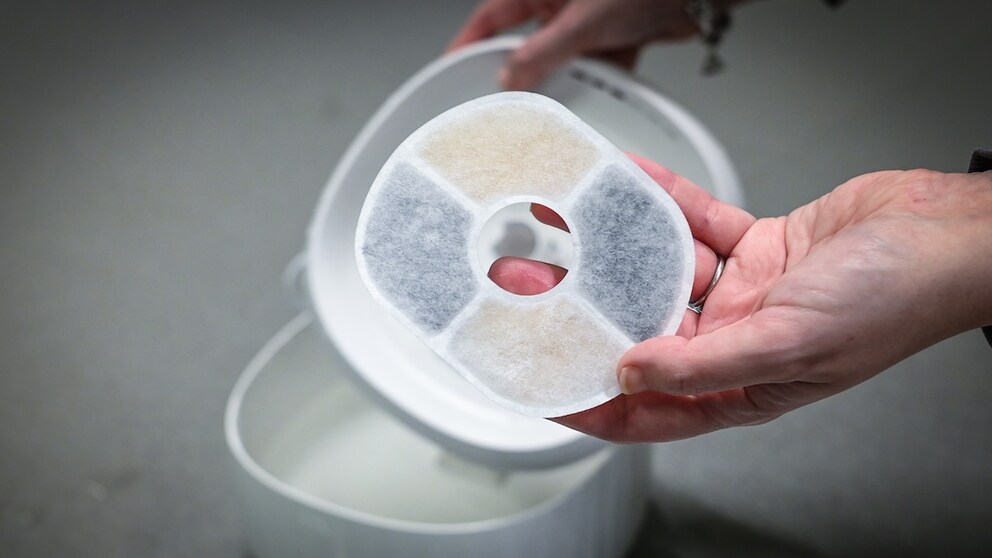 Louisa Stoeffler tests how easy the water fountains are to disassemble