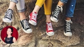 Drei Damen mit Chucks in Schwarz und Rot auf einer Mauer. Sie spiegeln ein schönes Lebensgefühl wider, wie ich finde. Gute Laune, Entspannung, Aktivität, gemeinsame Zeit, Sommer. Wundervoll!