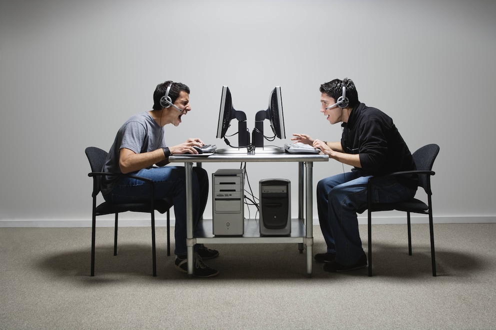 More calling. Sitting opposite. Students sitting opposite to each other. Meeting two man on Table. Many students sitting opposite to each other.