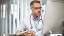 Cape Town, South Africa, Doctor sitting at desk