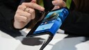 The folding and capabilities of the Royole FlexPai tablet and phone are demonstrated at the Royole booth at CES 2019 consumer electronics show, January 8, 2019 at the Las Vegas Convention Center in Las Vegas, Nevada.