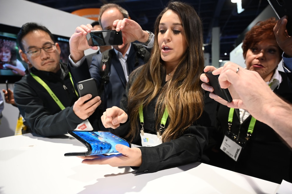 The folding and capabilities of the Royole FlexPai tablet and phone are demonstrated at the Royole booth at CES 2019 consumer electronics show, January 8, 2019 at the Las Vegas Convention Center in Las Vegas, Nevada.