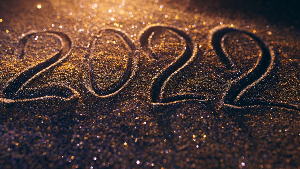 Highlights 2022 Schriftzug in leuchtendem Sand