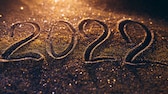 Highlights 2022 Schriftzug in leuchtendem Sand