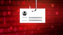 Symbolbild für Phishing: Kärtchen mit Username und Passwort am Angelhaken vor rotem Hintergrund