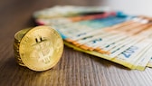 Mit Bitcoin, Ethereum und Co. lässt sich auch in Geschäften zahlen. Doch auf ein paar Dinge sollte man achten.