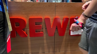 Rewe Logo auf der Gamescom 2023