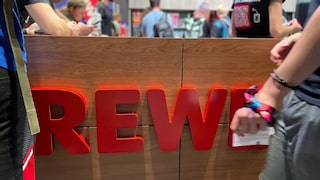 Rewe Logo auf der Gamescom 2023