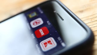 Icons der Apps verschiedener Handelsketten auf Smartphone