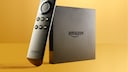 An Amazon Fire 4K TV box and remote control