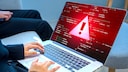 Wanrzeichen auf einem Laptop