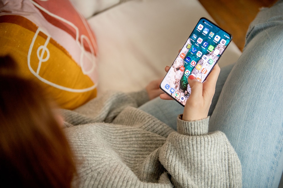 A woman uses her smartphone
