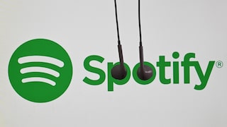 Spotify-Logo mit In-Ear-Kopfhörern, die über das Logo hängen
