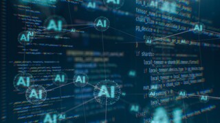Es sind mehrere kleine AI Zellen zu erkennen, die alle miteinander verbunden sind. Außerdem erkennt man etwas verschwommen mehrere AI Codes im Bild.
