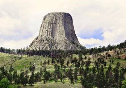 Amidst beautiful scenery stands the peculiar Devil's Tower