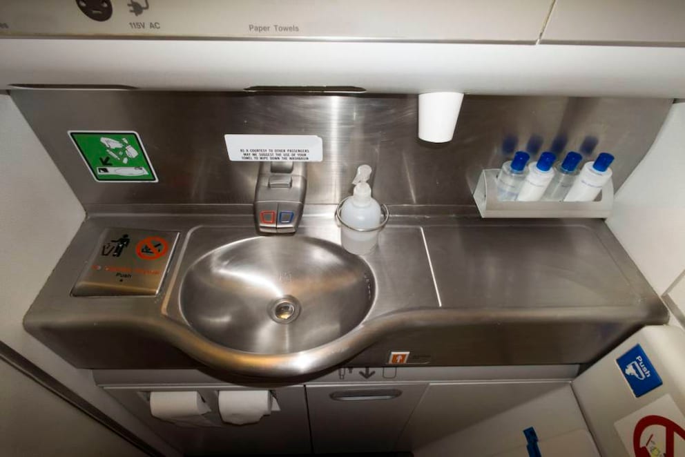 Better not to touch the airplane toilet faucets due to germs