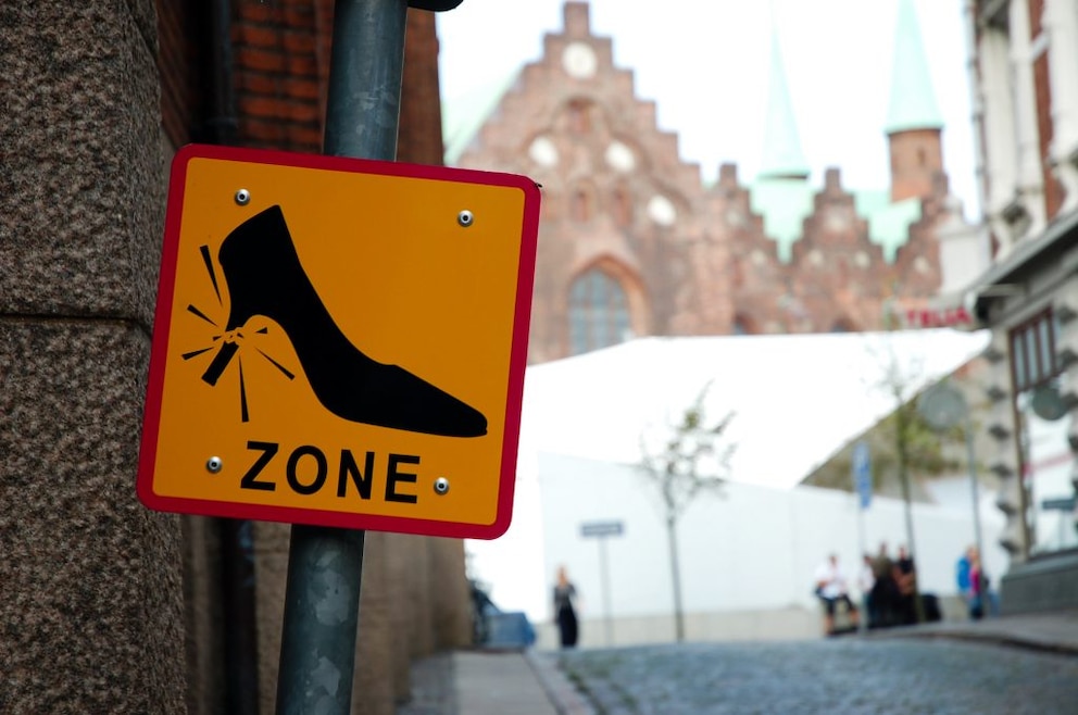 It takes not only courage but also a lot of skill to walk on cobblestones in high heels