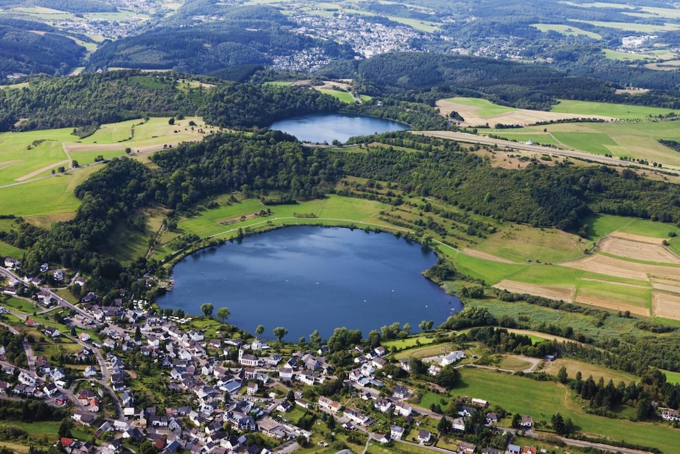 The Eifel is known for its maars, here you can see the Schalkenmehrener Maar and behind it the Weinfelder Maar (Totenmaar)