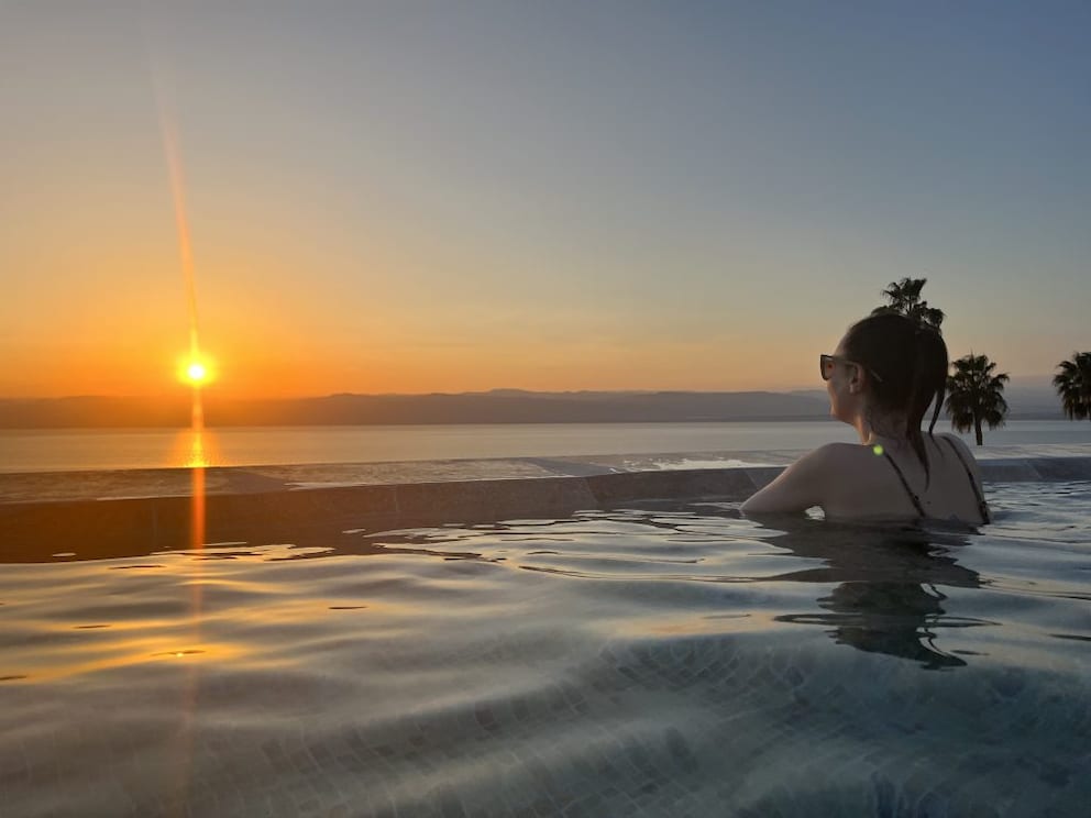 TRAVELBOOK editor Larissa enjoying the sunset over the Dead Sea