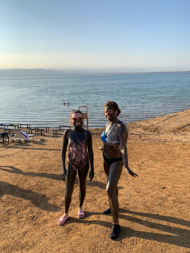 Person covered in Dead Sea mud
