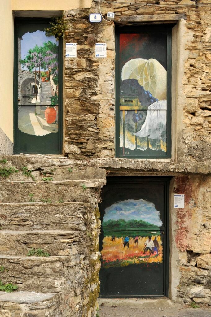 Walking through Valloria, you'll discover art on various doors–some works are nearly 30 years old
